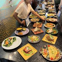 The staff explains the many visual menu items.  It's great to see what the choices are.  at House of Wonders in Cascais