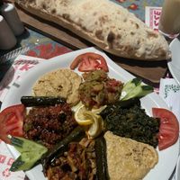 Large mezze platter with vegan bread   at Kale Terrasse Restaurant in Nevsehir