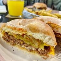 Vegan cheeseburger with beyond, vegan cheddar, vegan mayo, sweet onion, pickles, ketchup and mustard at Baka Vieja Burger Shop in Gijon