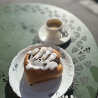 Frosted cinnamon roll and coffee  at Vegalicious Pastry in Helsinki