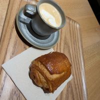 Pain au chocolate and cappuccino prepared wit oat milk at Land & Monkeys - Grands Boulevards in Paris