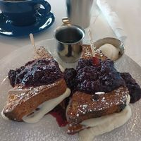 Stuffed cinnamon raisin french toast with blueberry compote. at FiKA in Grand Rapids