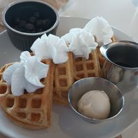 Belgian waffles with blueberries on the side. at FiKA in Grand Rapids