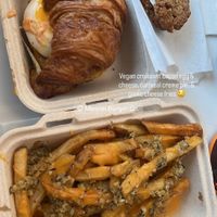 Croissant sandwich (with vegan egg and bacon), garlic cheese fries, and oatmeal crème pie (supplied by Flour + Time)  at Mission Burger Co. in Atlanta