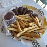 Lemon pepper wet wings with fries   at Mission Burger Co. in Atlanta