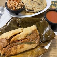 guatemalan tamal and some pupusas in the back  at Vegatinos  in North Hollywood