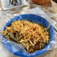 One pupusa with beans and one with squash, plus salsa and coleslaw  at Pupusería Zoila Olocuilta in Olocuilta