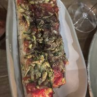 Catalan Coca bread, confit tomato, heirloom zucchini, citrus ash   at Smith & Daughters in Collingwood