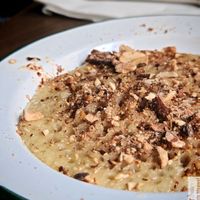 Baghrir pancakes, the famous pancakes with a thousand holes, served with orange blossom agave syrup and roasted almonds at La Cuisine de Souad @ Ernest & Souad in Paris