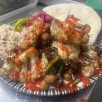 Sriracha and lime cauliflower, chickpea and kale bake with tabouleh and flatbreads  at The Deli Social in Sutton Coldfield