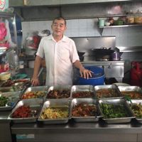 Owner with food offering at PJ Oldtown Foodcourt - Mixed Rice Stall in Petaling Jaya