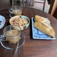 Breakfast (coffee, banh mi, and spicy corn)  at Yên Homestay & Vegan Macrobiotic in Hoi An