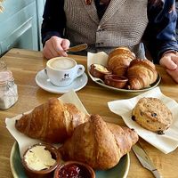 Croissants, a scone, and a cappuccino: a concert of European breakfast options. 😉  at Koffie ende Koeck in Amsterdam