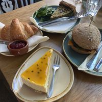 Spinach quiche, croissant, passion fruit cheese cake, pulled & spicy mushrooms sandwich   at Koffie ende Koeck in Amsterdam