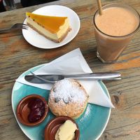 Vegan mango passion fruit cheesecake and vegan scone  at Koffie ende Koeck in Amsterdam