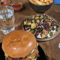 Festive chkn burger, roasted sprouts fries at Hinterland Alcohol-Free Bar and Cafe in Manchester