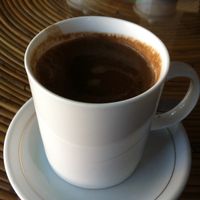 Hot cacao with coconut cream at OM Kampot in Kampot