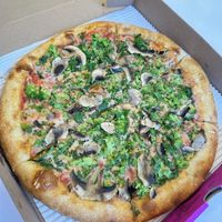 Vegan 12” pie with vegan cheese, broccoli rabe and mushrooms   at Elements Pizzeria  in Jackson Heights