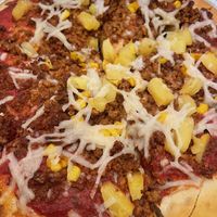 Vegan “ground beef” pizza with corn and tomatoes, super yummy!!  at Bottoms Up Pizza in Richmond
