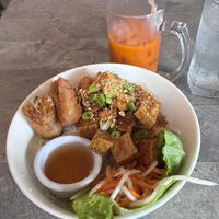 Lemongrass vermicelli noodles with tofu snd veg spring roll, and thai iced tea with coconut milkk  at Tin Corner in Frederick