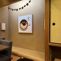 Interior with restaurant logo  at Cafe Groovy in Nara