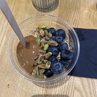 Build your own acai bowl with vegan granola, blueberries, pistachio and almond butter.   at ORA Wellness Cafe in Norwich