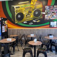 Indoor seating and wall mural at Rhythm 'n Wraps in Boston