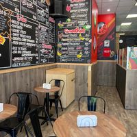 Wall menu of smoothies at Rhythm 'n Wraps in Boston