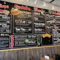 Vibrantly painted wall menu at Rhythm 'n Wraps in Boston