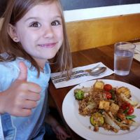 A happy customer eating the Thai Grille Fried Rice with Tofu. at Thai Grille in Westerville