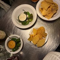 Smaller padron peppers with a different sauce to be vegan! The salsa with the chips was unreal  at Mæxico City in Copenhagen