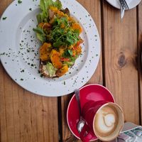 Bread with roasted veggies and flat white with oatmilk at Chrismann at The Trading Post in Swakopmund