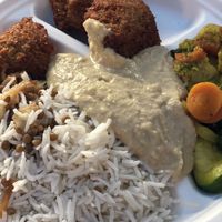 Rice with lentil and onions, hummus, falafel, curry vegetables  at Orient Experience II in Venice