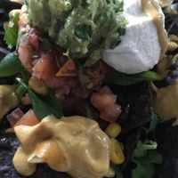 Nachos loaded with vegan queso, cashew cream and guac at Seed - Faubourg Lafayette in New Orleans