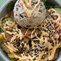 Fruity bowl with mango kimchi rice carrots cucumber salad and simili chicken. Very good, filling and healthy.  at Katzentempel Berlin Mitte in Berlin