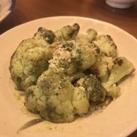 Side Dish: Roasted Cauliflower in pesto sauce - topped with grated parmesan cheese  at Prem Bistro and Cafe in Ho Chi Minh City
