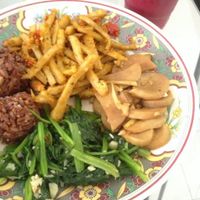 prem takeout; brown rice avocado balls, spinach, mushrooms with ginger and seitan at Prem Bistro and Cafe in Ho Chi Minh City