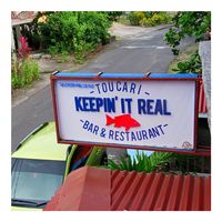 Venue sign at Keepin' It Real in Toucari