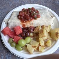 Cuban Burrito with tofutti cream cheese sub for cheddar. Extra veg sub for eggs. Side of roasted potatoes   at Wild Hare in Bemidji