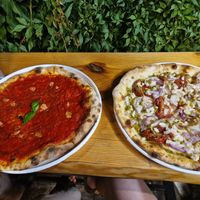 Pizza marinara e pizza con pesto, cipolla e pomodorini secchi (e mozzarella di riso) at La Caorlotta in Caorle