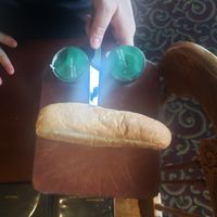 The large portion entree came with bread, a green salad or minestrone soup, and an ice cream. Our server, Gabriel, made me a raspberry sno cone. at The Old Spaghetti Factory in Banff