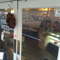 Happy Cow sticker at The PINK WEED Cafe in Kobe