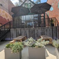 Outdoor seating to the side of the restaurant at Neon Greens  in St Louis