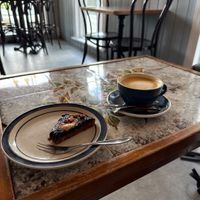 Vecan cake and coffee with oat milkk  at Paname Café in Torshavn