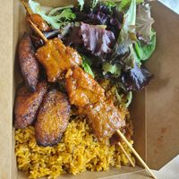 Sampler plate: Arroz con gandules,BBQ CHN Pincho, side salad and maduros at Casa Borinqueña in Philadelphia