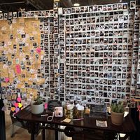 They let every new customer have one free photo to put on the wall  at Momo Cafe in Minneapolis