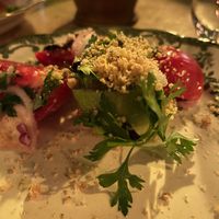 Georgian tomato and cucumber salad with walnuts. at Shavi Lomi - შავი ლომი in Tbilisi