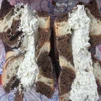 Whole wheat pumpernickel with vegan herb garlic cc  at Bergen Bagels - Bergen St in Brooklyn