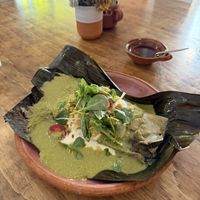 Tamal de frijol con mole verde  at Na Tlali - Reforma in Mexico City