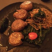 Tofu à la lagareiro, with seaweed, spinach and potatoes at Em Carne Viva in Porto